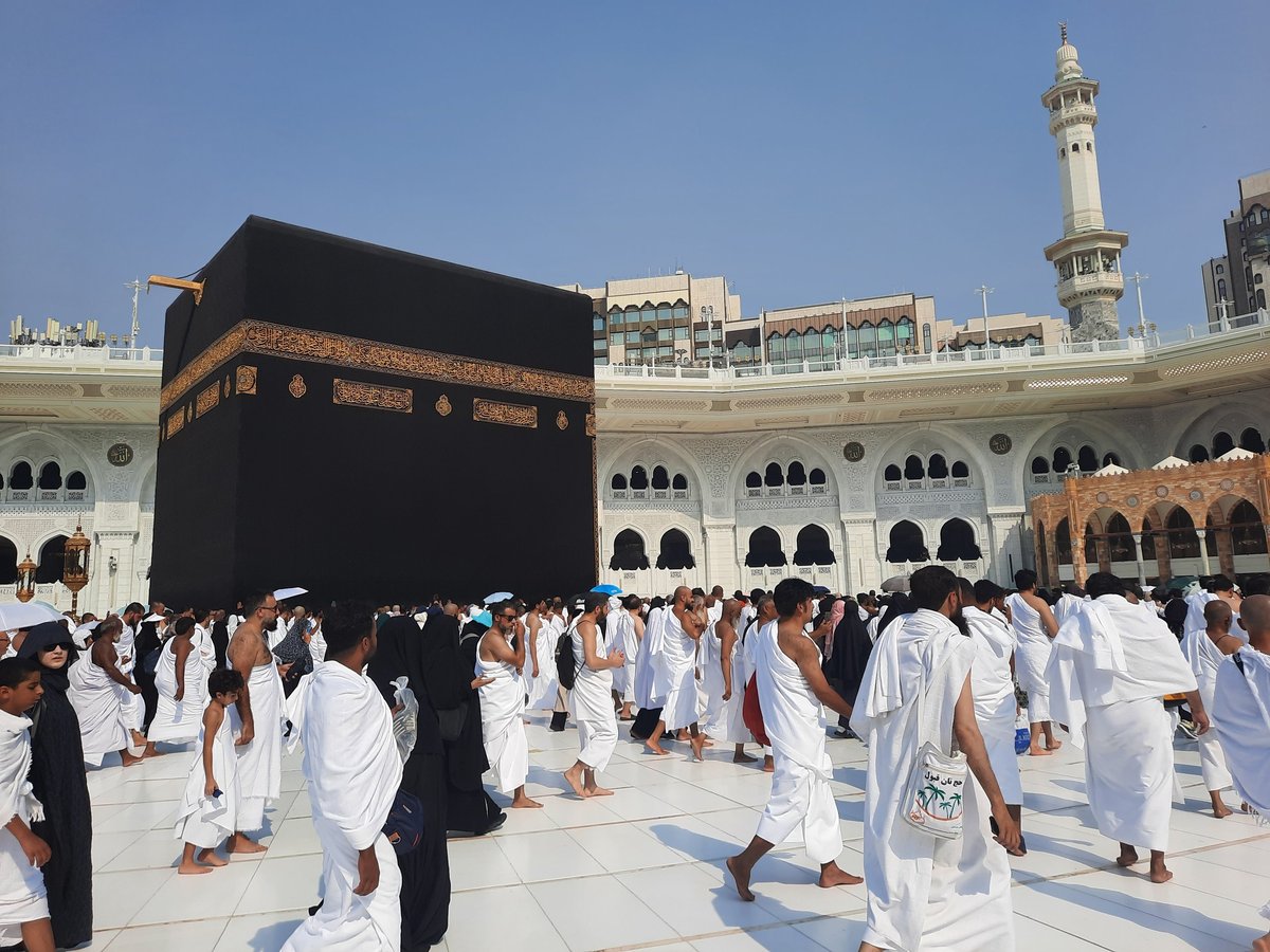 Pilgrims at Masjid al-Haram courtyard — the Jamarat stoning ritual